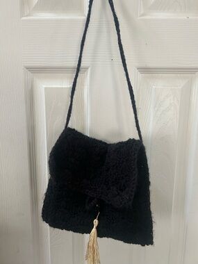 Handcrafted Black Crochet Shoulder Bag with Gold Tassel.